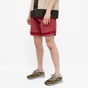 Adsum Effo Nylon Drawstring Shorts in the‎ color raspberry